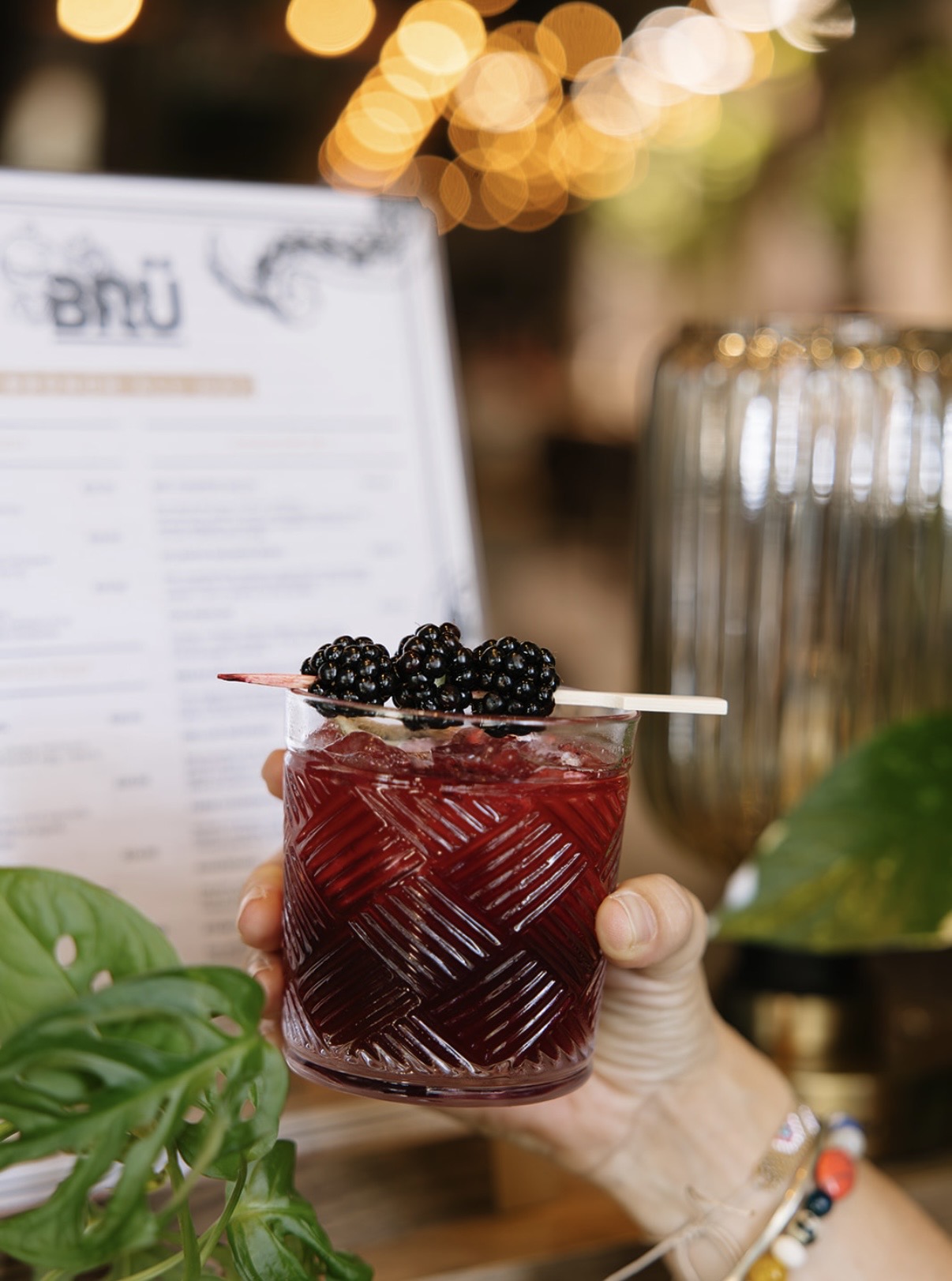 Blackberry brunch cocktail garnished with fresh blackberries at Brü Avl in downtown Asheville